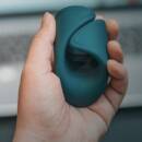 The Lovense Gush is a flexible and hands-free glans massager with a curved, wrap-like design that surrounds the penis and stimulates the tip.