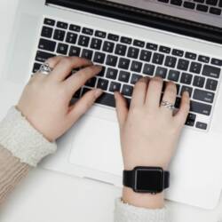 hands at computer